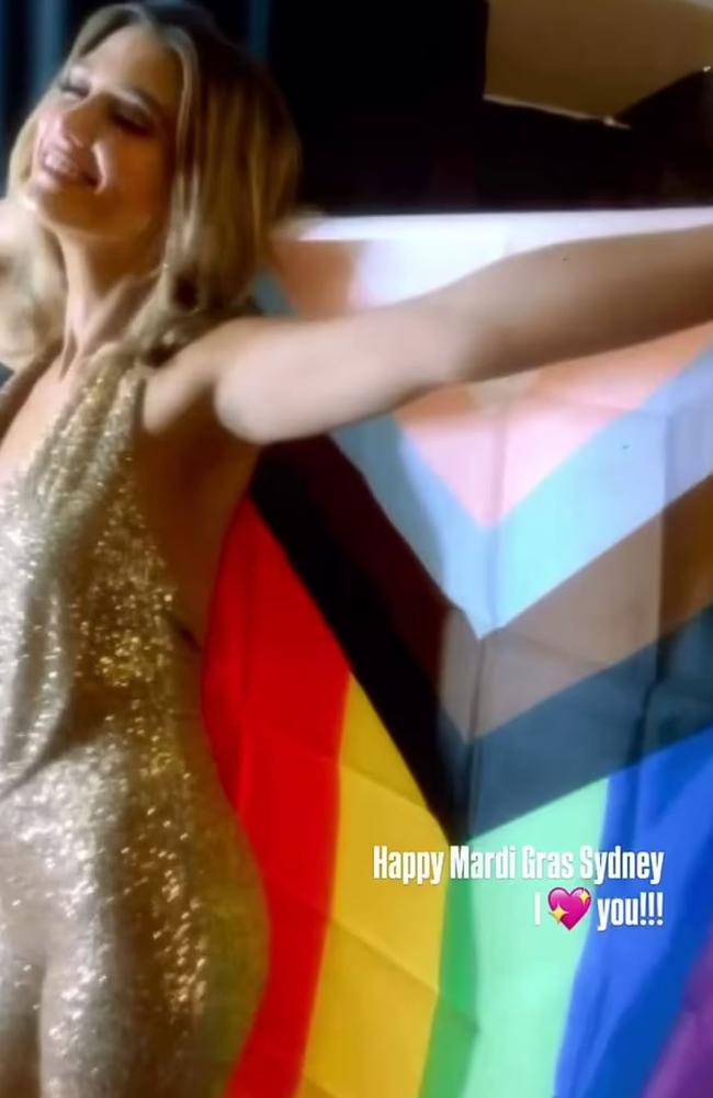 Delta Goodrem was seen enveloped in a pride flag. Picture: Instagram/deltagoodrem