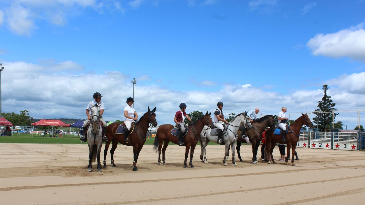 Competitors lined up to participate in a minute silence for the late Frances Day at the Murgon Show. Photo: Laura Blackmore