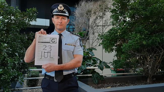 Chief Superintendent Mark Wheeler shows new-look border pass. Picture: BRIANNA MORRIS-GRANT.