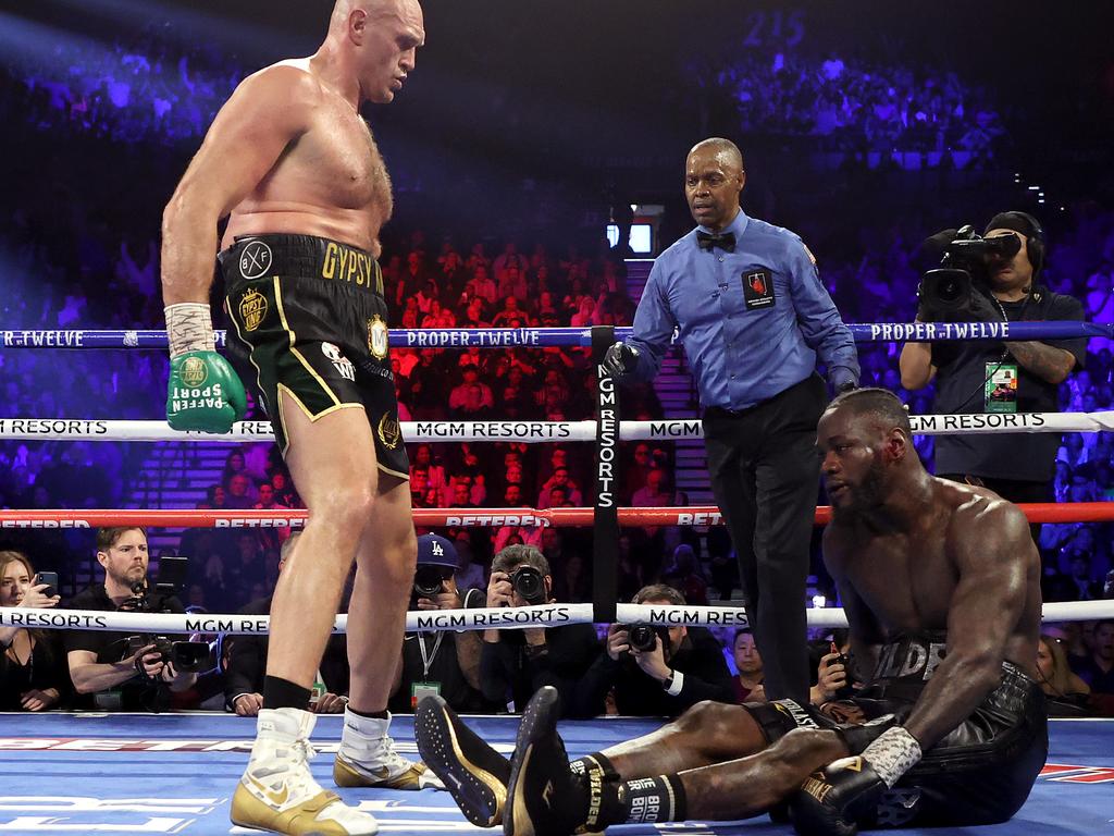 Tyson Fury knocks down Deontay Wilder during their last fight.