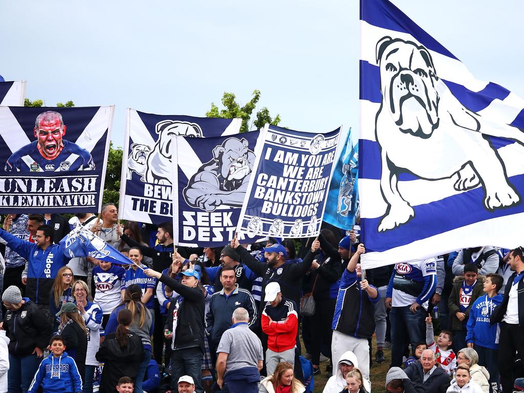 SYDNEY, AUSTRALIA - AUGUST 26: Bulldogs supporters celebrate a try during the round 24 NRL match between the St George Illawarra Dragons and the Canterbury Bulldogs at UOW Jubilee Oval on August 26, 2018 in Sydney, Australia. (Photo by Mark Kolbe/Getty Images)