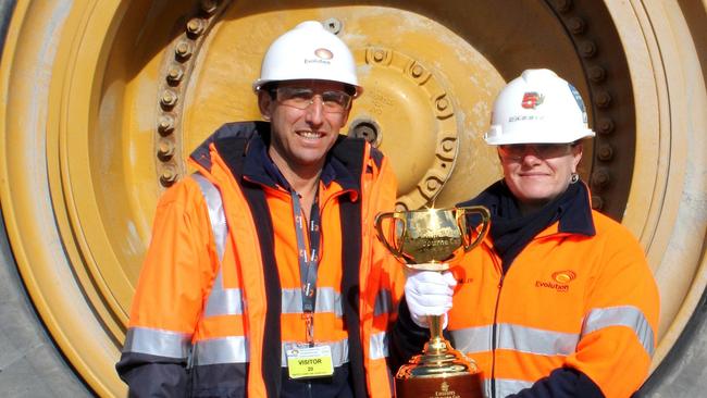 Evolution chairman Jake Klein and Cowal employee Cassie Schiller with the Melbourne Cup at the Cowal gold mine.