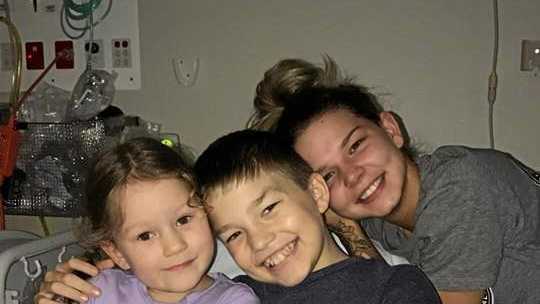 NEW KIDNEY: Damon Merry with his two sisters, Isabeau and Alex during one of Damon's many hospital visits. Picture: Natasha Burrows