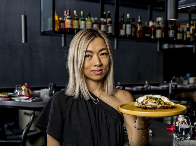 Owner Thao Nguyen holding the Jumbo Oyster dish. Picture: Jerad Williams