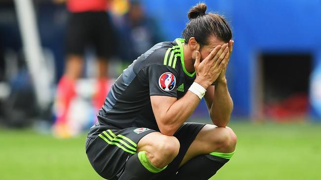 Gareth Bale of Wales shows his dejection after England's second goal.