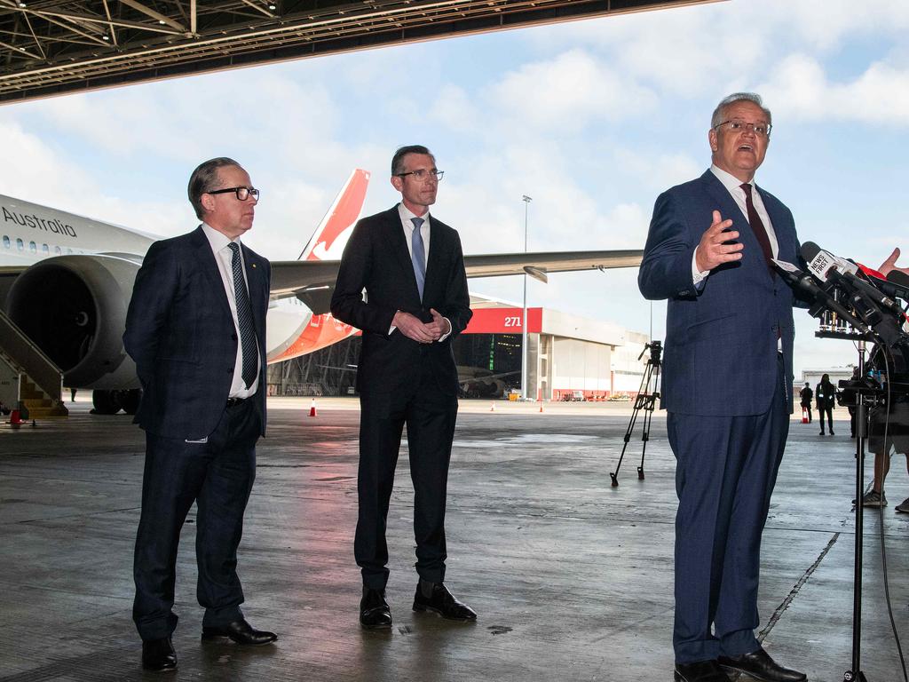 Qantas CEO Alan Joyce, NSW Premier Dominic Perrottet, and Prime Minister Scott Morrison at the Qantas Jet Base at Sydney Airport. Picture: NCA NewsWire/Bianca De Marchi