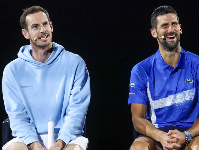 Britainâs Andy Murray (L) reacts with Serbiaâs Novak Djokovic during a charity event titled âNight with Novakâ on Rod Laver Arena in Melbourne on January 9, 2025 ahead of the Australian Open tennis championship starting on January 12. (Photo by DAVID GRAY / AFP) / -- IMAGE RESTRICTED TO EDITORIAL USE - STRICTLY NO COMMERCIAL USE --