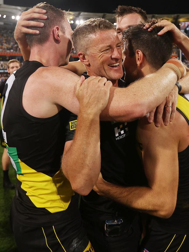 Hardwick is hugged by his players after the 2020 grand final win. Picture: Michael Klein