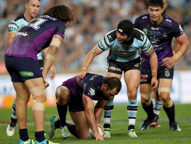 Ennis gives it to his old rival Cameron Smith. Picture: Brett Costello