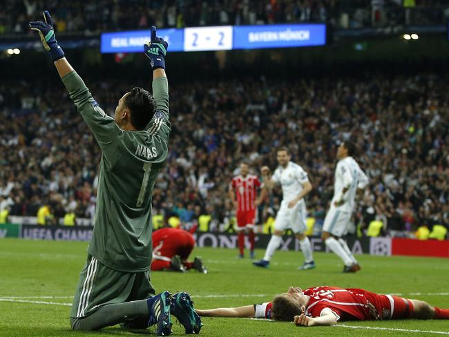 Real Madrid's goalkeeper Keylor Navas celebrates after Madrid reached its third straight Champions League final 4-3 on aggregate at the Champions League semifinal second leg soccer match between Real Madrid and FC Bayern Munich at the Santiago Bernabeu stadium in Madrid, Spain, Tuesday, May 1, 2018. (AP Photo/Paul White)