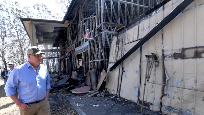 Prime Minister Scott Morrison inspecting a burnt out property at Binna Burra on September 13. Picture: AAP Image/Dave Hunt