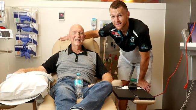 Port Adelaide’s Robbie Gray visits Oncology Day Centre patient and Power fan Terry Harbutt at the Royal Adelaide Hospital to raise awareness about men's health. Picture CALUM ROBERTSON