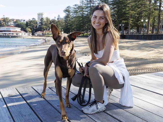 Bella Yeaman, 23, of Manly, with her dog Finn. Picture: David Swift.