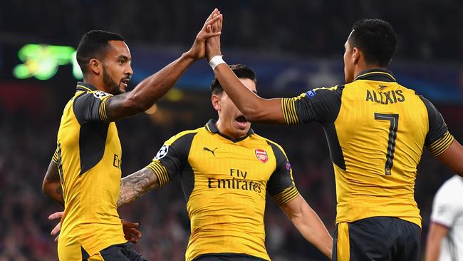 Theo Walcott of Arsenal celebrates with Alexis Sanchez.