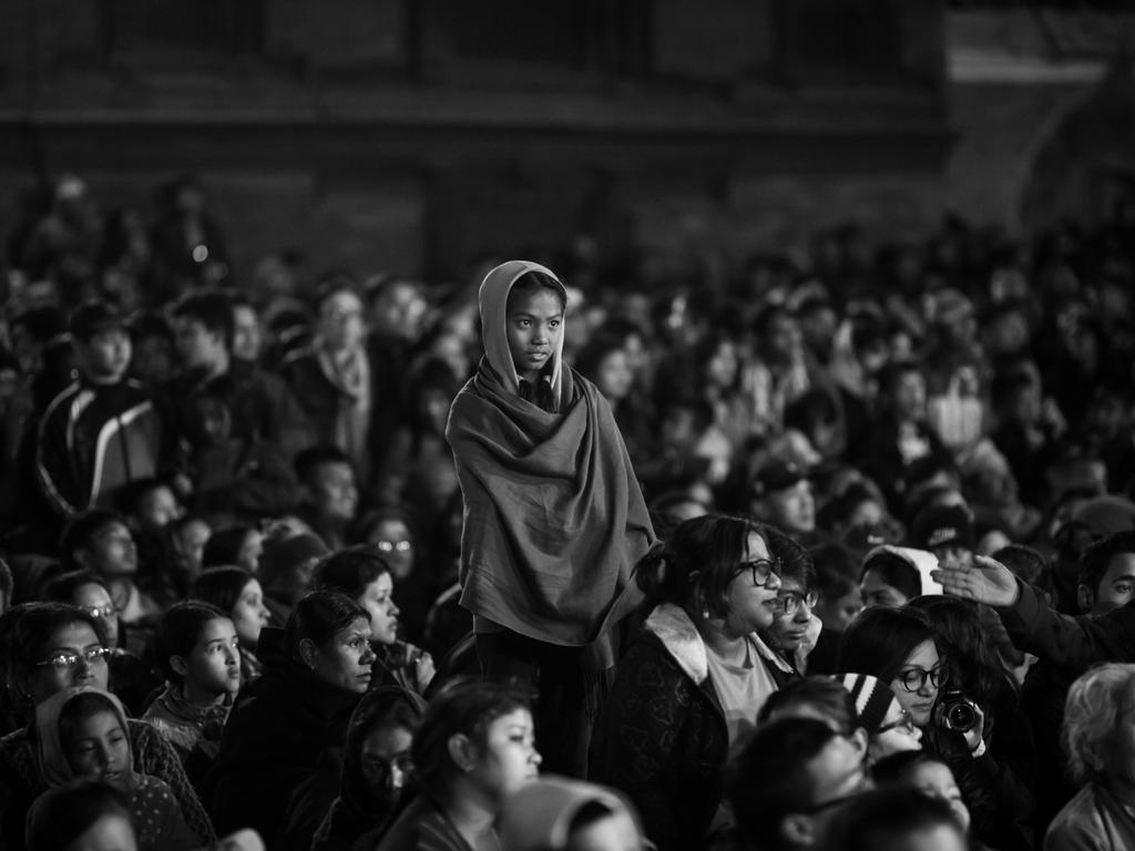 Image Name: The Audience Photographer Name: Ajay Maharjan Year: 2018 Image Description: A girl along with other locals observe a traditional dance known as ‘’Kartik Naach’’ at mid night in Lalitpur on the outskirts of Kathmandu.The religious dance is performed over ten days in the Nepalese calendar known as Kartik to thank Lord Kumara for his protection. The Kartik Nach was first established by the devout King Siddhi Narsingh Malla in the 17th century. Copyright: Ajay Maharjan, 3rd place, Nepal National Award. Picture: Sony World Photography Awards/ Ajay Maharjan