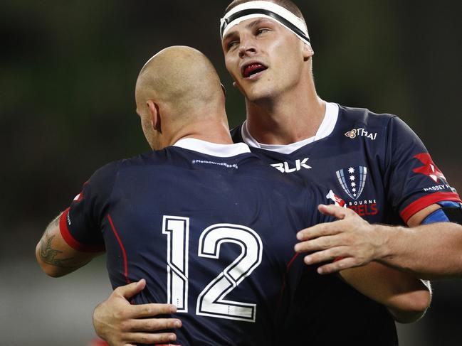 Luke Jones (right) celebrates a Bill Meakes try against the Highlanders last Friday.