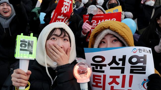 Protesters celebrate as the parliament votes to impeach South Korean president Yoon Suk Yeol over his decision to impose a martial law, in front of National Assembly on December 14, 2024 in Seoul, South Korea. Picture: Getty Images.