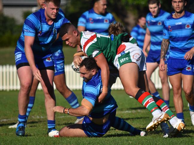 Byron Aiolupotea tackles Jad Mahmoud. Picture: Sean Teuma/NewsLocal