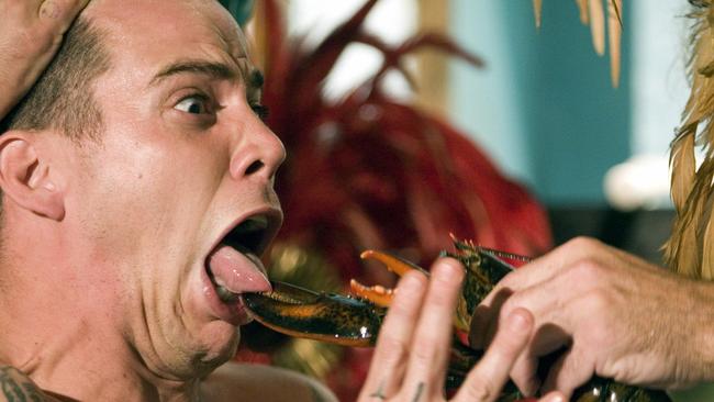 Steve-O has his tongue pinched by a lobster in scene from 2006 film Jackass Number 2.