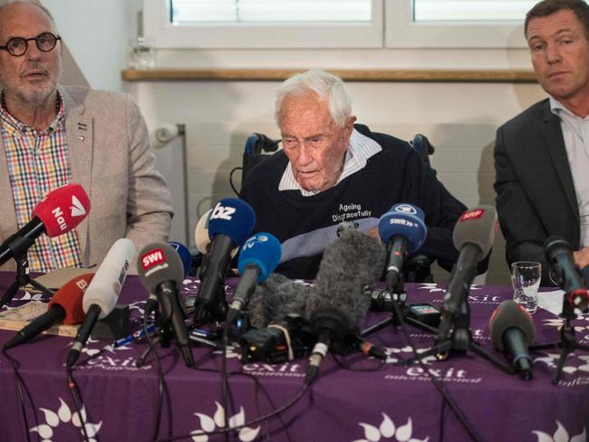 The Australian scientist is flanked by Exit International founder and director Dr. Philip Nitschke (left) and Doctor Moritz Gall (right). Picture: Sebastien Bozon