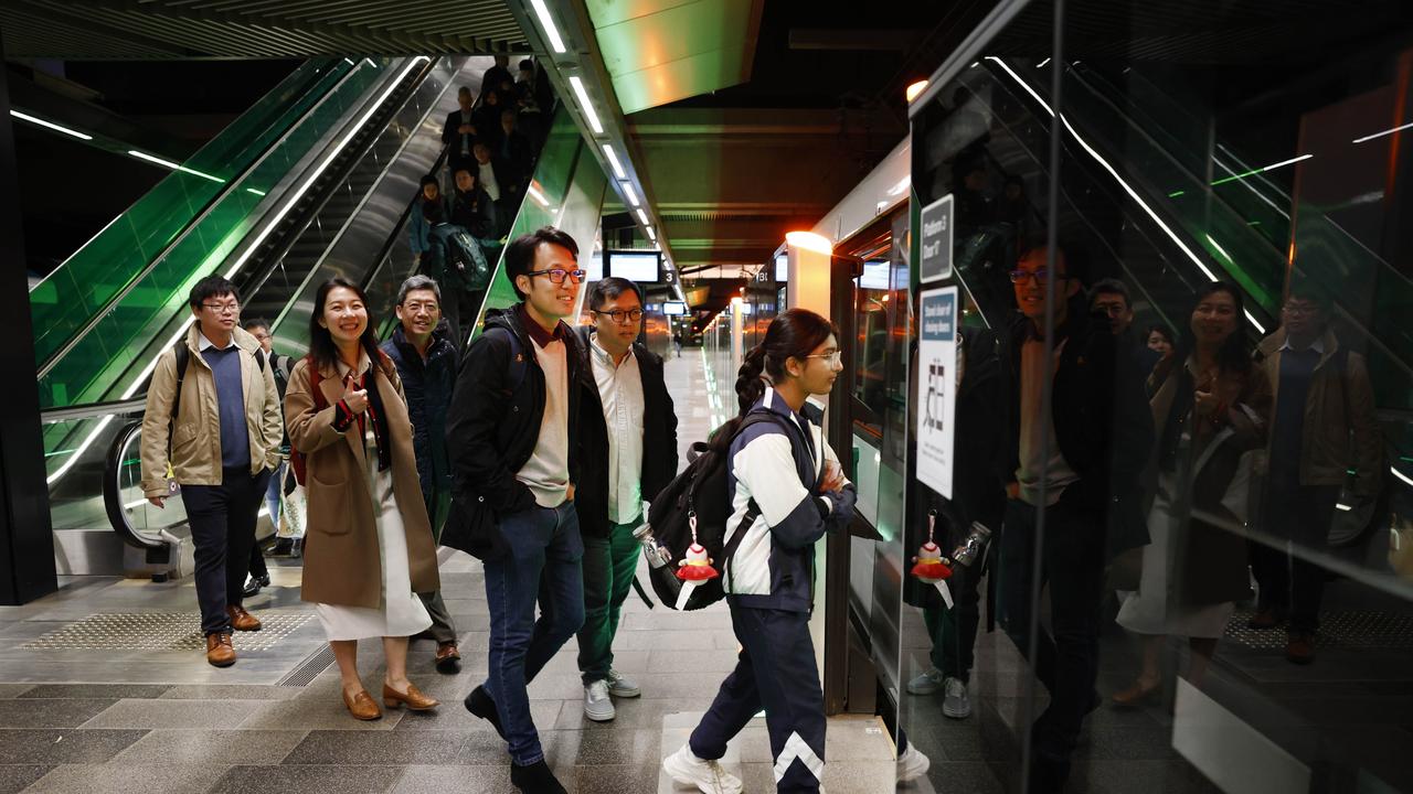 Commuters board one of the first Sydney Metro trains on its way back in to the city. The brand new Sydney Metro had its maiden run to Tallawong leaving Sydenham Station at 4.54am.. Picture: Richard Dobson / Newswire