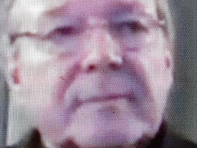 Cardinal George Pell is seen on a screen as he gives evidence to the Royal Comission into Institutional Responses to Child Sexual Abuse via video link from Rome in Canberra, Monday, Feb. 29, 2016. (AAP Image/Lukas Coch) NO ARCHIVING