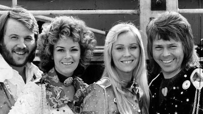 Pop music band ABBA says the reason they wore such outrageous outfits on stage was to ens