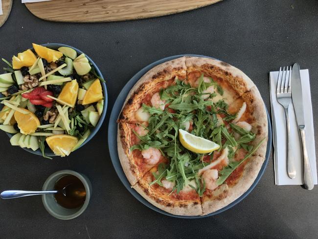 Corbett &amp; Claude’s fisherman's pizza and dreamer salad. Picture: Jenifer Jagielski