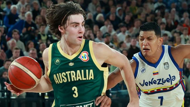 MELBOURNE, AUSTRALIA - AUGUST 14: Josh Giddey of the Boomers dribbles the ball under pressure from Jhornan Zamora of Venezuela during the match between Australia Boomers and Venezuela at Rod Laver Arena on August 14, 2023 in Melbourne, Australia. (Photo by Kelly Defina/Getty Images)