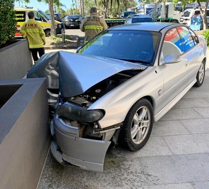 A woman has escaped injury after crashing her car into a wall in Tweed Heads.