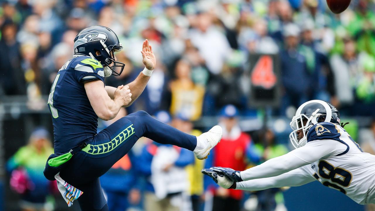 Michael Dickson punts against the Los Angeles Rams.