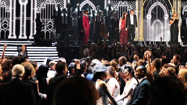 Mary Lambert, Macklemore, Queen Latifah Ryan Lewis perform at the Grammys as more than 30 couples marry live on air. Picture: Kevork Djansezian/Getty Images