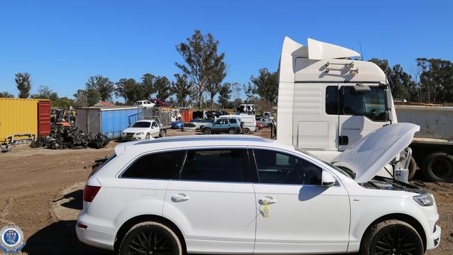 Police executed a search warrant at a business in Austral on Thursday morning and allegedly uncovered stolen vehicles. Pictures: NSW Police