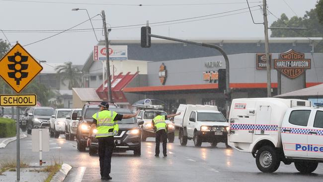 Police officers direct traffic on Sheridan Street, Cairns North, after the road was closed near the Airport Ave intersection on Monday. Picture: Brendan Radke