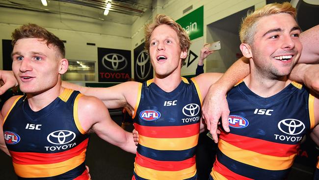 Rory Laird, Rory Sloane and Rory Atkins celebrate the Crows’ big win against Richmond.