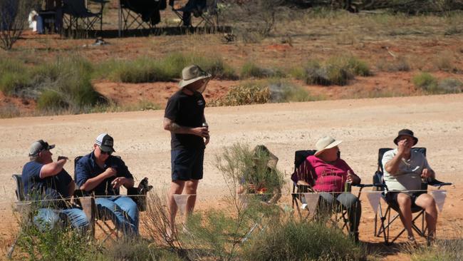 Spectators have gathered to watch competitors tackle day one of the 2024 Tatts Finke Desert Race. TFDRDO09062024