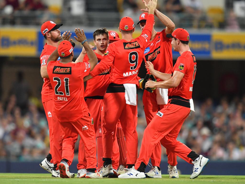 Cameron Boyce (centre) celebrates with teammates after getting the wicket of Matthew Renshaw. Picture: AAP