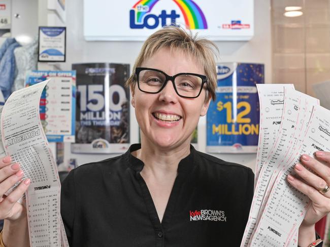 ADELAIDE, AUSTRALIA - NewsWire Photos MAY 22, 2024: Kylie Brown in her Glenelg newsagency with Powerball syndicate entries. The jackpot this week is $150 million. Picture: NCA NewsWire / Brenton Edwards