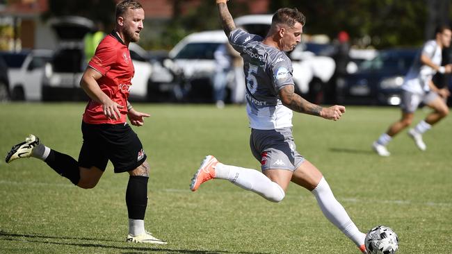 Morgan Filer gets a kick for Caroline Springs George Cross. Picture: Andrew Batsch