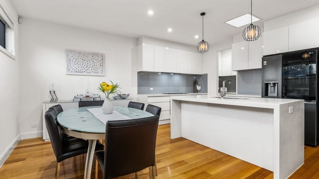 A butler’s pantry, a 900mm oven and a cooktop in the stone-fitted kitchen.