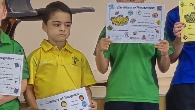 Townsville boy Liam Layt, in yellow, is fighting Duchenne muscular dystrophy, a muscle-wasting disease for which there is currently no cure. Picture: Supplied