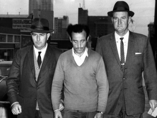 MAY 14, 1963 : Police officers Detective sergeants James Black (L) & Jack Ford arrest William McDonald, (aka The Mutilator) to question him at Police Headquarters in Russell Street, Melbourne where he was later charged with killing four Sydney drunks in 1961-1962. NSW / Crime / MurderVictoria