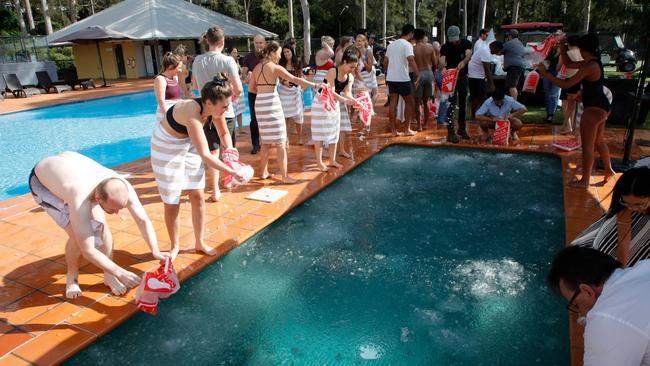 Employees participate in the ice bath.