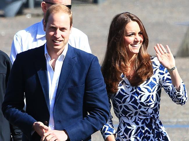 Royal wave ... Prince William and Duchess Kate visit the fire effected town of Winmalee in the Blue Mountains. Picture: Adam Taylor