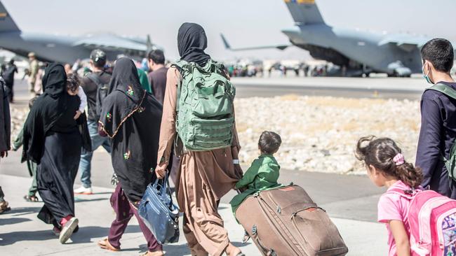 Refugees make their way to emergency evacuation flights. Picture: AFP/Samuel Ruiz