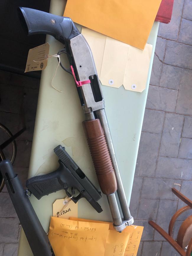 A sawn-off shotgun and pistol found during raids on the man’s home and workplace. Picture: ABF