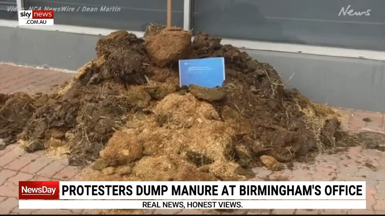 Protesters dump manure outside Finance Minister Simon Birmingham's office