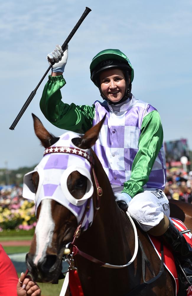 Michelle Payne celebrates as she returns to the mounting yard on Tuesday / Picture: AAP