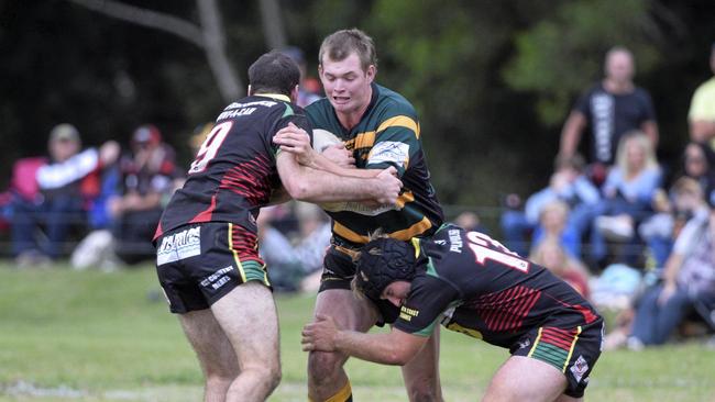 Orara Valley Axemen forward Cain Bunt hits the ball up.