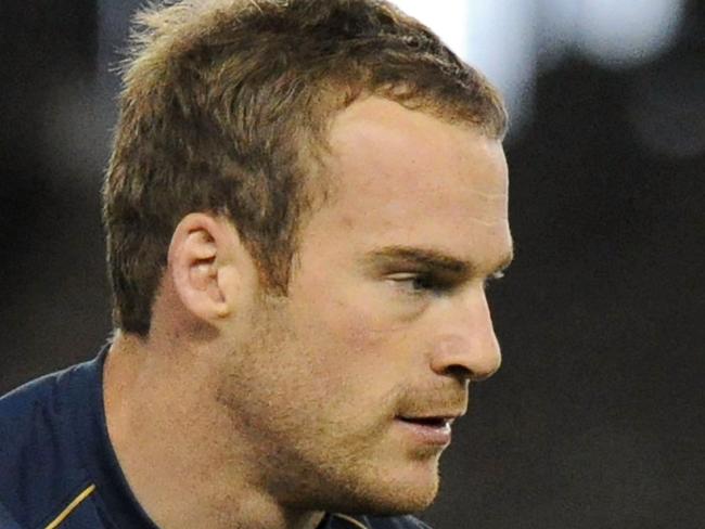 (FILES) A file photo taken on June 13, 2014, shows Australian Wallbies player Pat McCabe attending the captains run in the lead up to the second test between the Australian Wallabies and France in Melbourne. Wallaby back Pat McCabe has retired from rugby after fracturing his neck for a third time, his ACT Brumbies coach Stephen Larkham said on August 27, 2014. AFP PHOTO / FILES / Mal FAIRCLOUGH IMAGE STRICTLY RESTRICTED TO EDITORIAL USE - STRICTLY NO COMMERCIAL USE